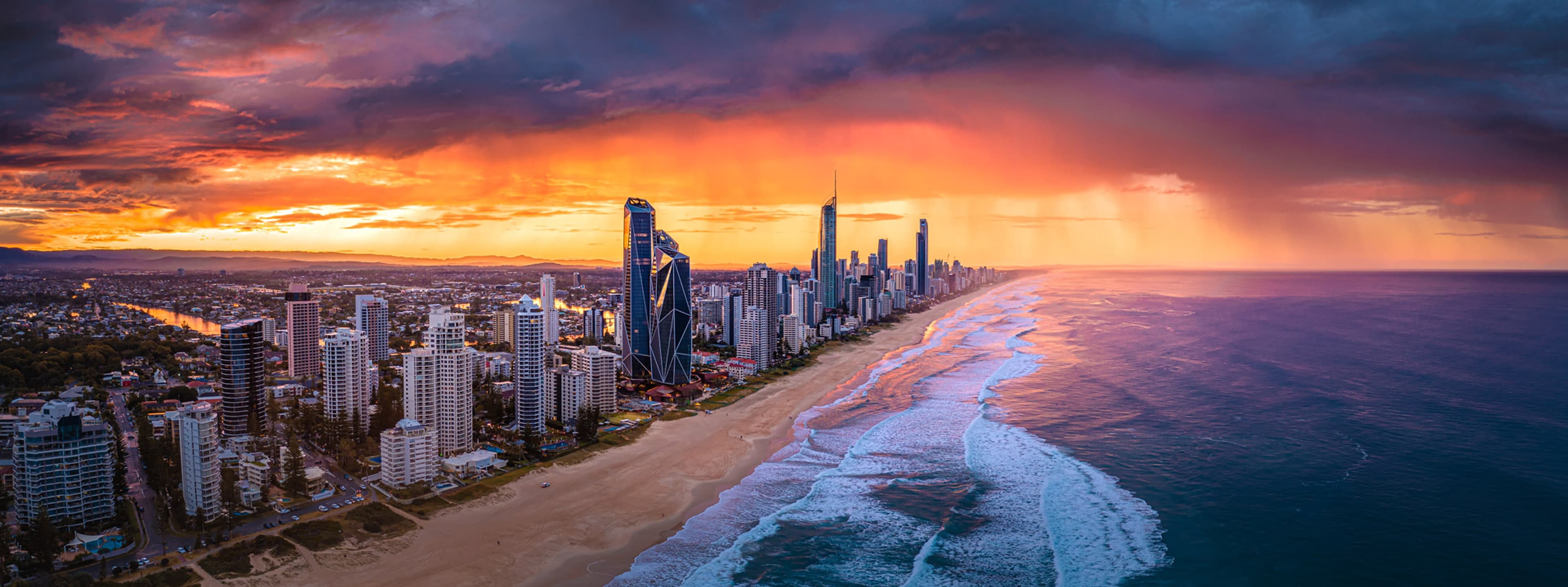 The Gold Coast at sunset, Surfers Paradise towers and the beach to the horizon