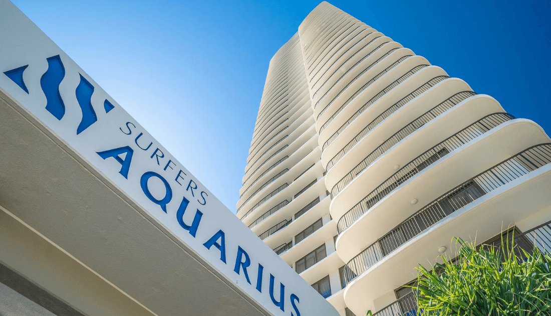 The Surfers Aquarius sign against the curved tower